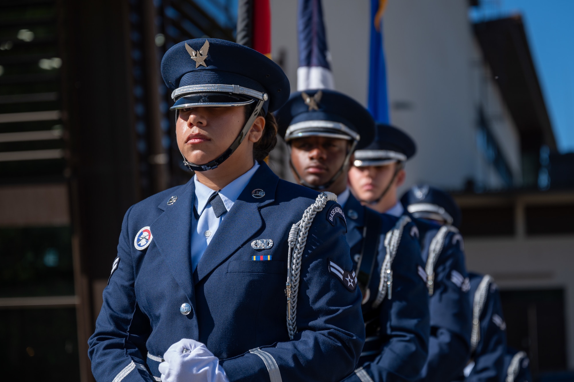 U.S. Air Force base honor guardsmen assigned to the 86th Airlift Wing standby at a POW/MIA remembrance ceremony