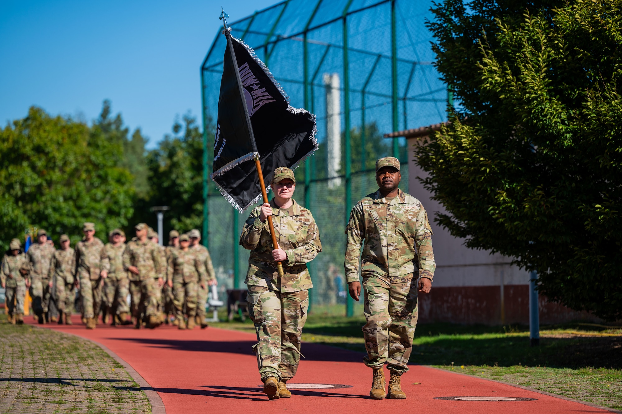 U.S. Air Force Brig. Gen. Adrienne L. Williams, 86th Airlift Wing commander, and Chief Master Sgt. Clifford L. Lawton, 86th AW command chief lead a POW/MIA remembrance walk