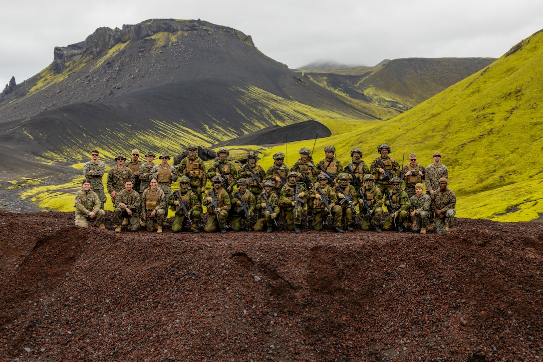 U.S. Marines and European allies pose for a group photo during an exercise at an undisclosed location within the European Theater, on Sept. 2, 2025.