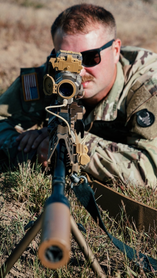 Soldiers with the 34th Infantry Division receive instruction on the M250 automatic rifle during a New Equipment Training fielding at Camp Ripley, Minn., September 15, 2025.