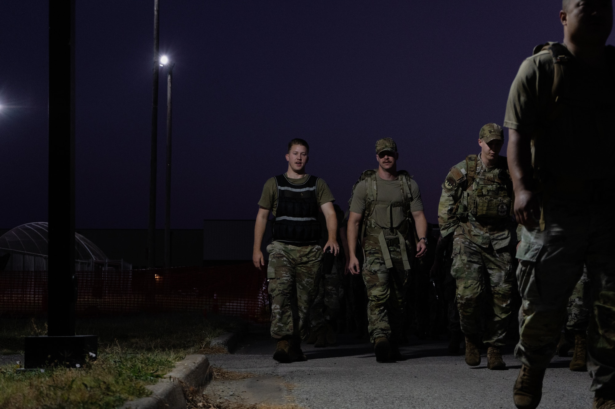 Master sergeant selects step off during a two-mile ruck march as part of the Senior Noncommissioned Officer Induction Course at Whiteman Air Force Base, Missouri, Sept. 17, 2025. The course incorporated physical training, leadership exercises and heritage events to prepare newly promoted senior NCOs for their expanded responsibilities.