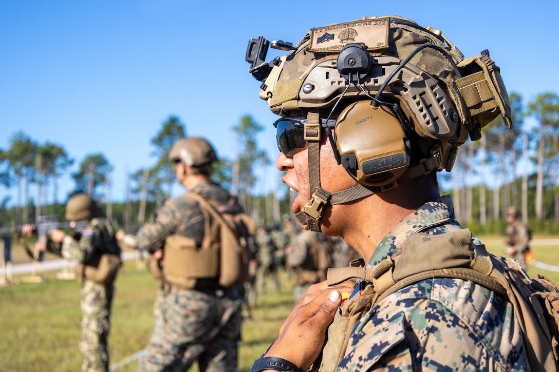 U.S. Marine Corps Cpl. Edwin Hernandezdelacruz, an anti-tank missileman with Golf Company, 2nd Battalion, 2nd Marine Regiment, and a native of Florida, translates range commands to marines with Comando de Infanteria de Marina Armada Paraguay (Paraguayan marines) during a multinational marksmanship range as part of exercise UNITAS 2025 at Marine Corps Base Camp Lejeune, North Carolina, Sept. 23, 2025. UNITAS, which is Latin for “unity,” was conceived in 1959 and has taken place annually since first conducted in 1960. This marks the 66th iteration of the world’s longest running annual multinational maritime exercise. (U.S. Marine Corps photo by Lance Cpl. Jack Labrador)
