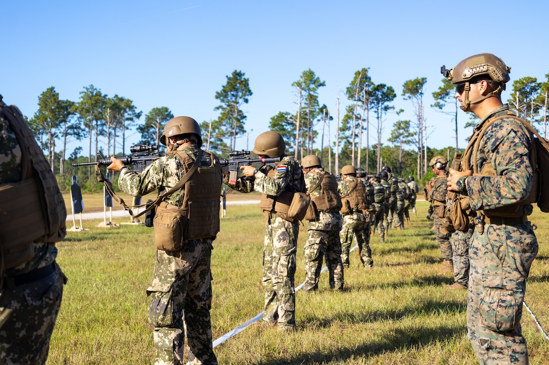 Marines with Cuerpo de Infanteria de Marina Armada de Mexico (Mexican marine corps) and Comando de Infanteria de Marina Armada Paraguay (Paraguayan marines) fire on a multinational marksmanship range while being supervised by U.S. Marines with Golf Company, 2nd Battalion, 2nd Marine Regiment, as part of exercise UNITAS 2025 at Marine Corps Base Camp Lejeune, North Carolina, Sept. 23, 2025. UNITAS, which is Latin for “unity,” was conceived in 1959 and has taken place annually since first conducted in 1960. This marks the 66th iteration of the world’s longest running annual multinational maritime exercise. (U.S. Marine Corps photo by Lance Cpl. Jack Labrador)