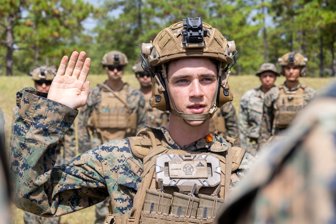 U.S. Marine Corps Lance Cpl. Luke Fitch, a rifleman with 2nd Battalion, 2nd Marine Regiment, and a native of Florida, recites the oath of enlistment during a multinational marksmanship range as part of exercise UNITAS 2025 at Marine Corps Base Camp Lejeune, North Carolina, Sept. 23, 2025. UNITAS, which is Latin for “unity,” was conceived in 1959 and has taken place annually since first conducted in 1960. This marks the 66th iteration of the world’s longest running annual multinational maritime exercise. (U.S. Marine Corps photo by Lance Cpl. Jack Labrador)