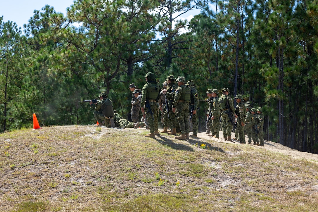 Marines with Infanteria de Marina Colombiana (Colombian naval infantry) participate in a live course of fire with U.S. Marines with 2nd Battalion, 2nd Marine Regiment, during a multinational marksmanship range as part of exercise UNITAS 2025 at Marine Corps Base Camp Lejeune, North Carolina, Sept. 23, 2025. UNITAS, which is Latin for “unity,” was conceived in 1959 and has taken place annually since first conducted in 1960. This marks the 66th iteration of the world’s longest running annual multinational maritime exercise. (U.S. Marine Corps photo by Lance Cpl. Jack Labrador)