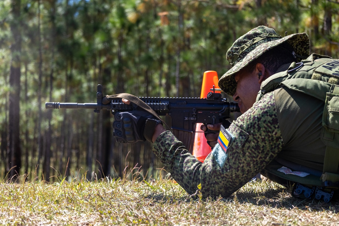 A marine with Infanteria de Marina Colombiana (Colombian naval infantry) engages targets down-range during a multinational marksmanship range as part of exercise UNITAS 2025 at Marine Corps Base Camp Lejeune, North Carolina, Sept. 23, 2025. UNITAS, which is Latin for “unity,” was conceived in 1959 and has taken place annually since first conducted in 1960. This marks the 66th iteration of the world’s longest running annual multinational maritime exercise. (U.S. Marine Corps photo by Lance Cpl. Jack Labrador)