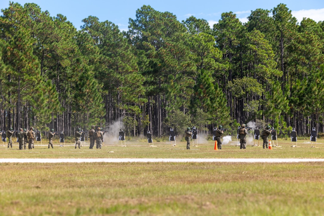Marines with Corpo de Fuzileiros Navais (Brazilian marine corps) engage targets while being supervised by U.S. Marines with Golf Company, 2nd Battalion, 2nd Marine Regiment, as part of exercise UNITAS 2025 at Marine Corps Base Camp Lejeune, North Carolina, Sept. 23, 2025. UNITAS, which is Latin for “unity,” was conceived in 1959 and has taken place annually since first conducted in 1960. This marks the 66th iteration of the world’s longest running annual multinational maritime exercise. (U.S. Marine Corps photo by Lance Cpl. Jack Labrador)
