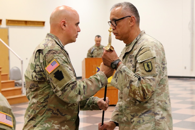 The 166th Regiment – Regional Training Institute held a change of responsibility ceremony Sept. 19, 2025 at Fort Indiantown Gap, Pa. Command Sgt. Maj. Oscar Laughman III relinquished responsibility of the regiment to Command Sgt. Maj. Charles Trofe. (U.S. Army National Guard photo by Sgt. 1st Class Shane Smith)