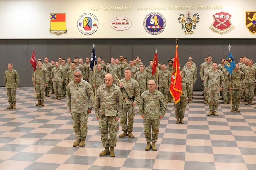 The 166th Regiment – Regional Training Institute held a change of responsibility ceremony Sept. 19, 2025 at Fort Indiantown Gap, Pa. Command Sgt. Maj. Oscar Laughman III relinquished responsibility of the regiment to Command Sgt. Maj. Charles Trofe. (U.S. Army National Guard photo by Sgt. 1st Class Shane Smith)