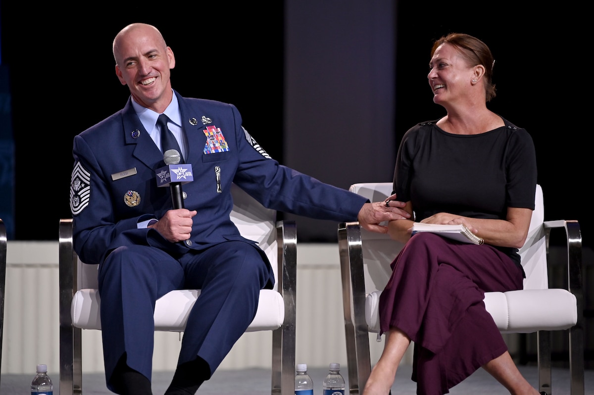 Air Force CMSAF and spouse participate in a discussion panel at AFA symposium.