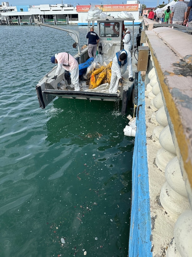 Coast Guard Incident Management Division personnel and Oil Spill Response Organization contractors conclude response efforts to secure two legacy pipe structures between piers 2 and 3 in San Juan Habor, Sept. 25, 2025.  Efforts concluded following operations by oil spill removal organization contractors to seal two legacy pipes to prevent any further discharge of oil into San Juan Harbor, followed by approximately three weeks of site monitoring with no signs of pollution in the water. (U.S. Coast Guard photo)