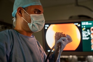 U.S. Air Force Lt. Col. Wassem Juakiem,  81st Healthcare Operations Squadron gastroenterologist, maneuvers an endoscope using the control dials during a colonoscopy at Hospital Dr. Gustavo Nelson Collado, in Chitré, Panama, Sept. 19, 2025 during AMISTAD 2025.. U.S. and Panamanian gastroenterologists performed endoscopic procedures that not only reduced delays for patients but also prepared Airmen to adapt with fewer resources. (U.S. Air Force photo by Andrea Jenkins)