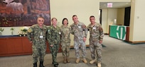 Medical personnel from the Albanian Armed Forces meet with U.S. Army Maj. Gen. Lisa J. Hou, D.O., director of the National Guard Bureau Office of the Joint Surgeon General, during the Rush International Advanced Trauma Training Course and Medical Exchange Event in Chicago, Sept. 12, 2025.