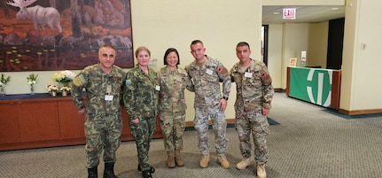 Medical personnel from the Albanian Armed Forces meet with U.S. Army Maj. Gen. Lisa J. Hou, D.O., director of the National Guard Bureau Office of the Joint Surgeon General, during the Rush International Advanced Trauma Training Course and Medical Exchange Event in Chicago, Sept. 12, 2025.