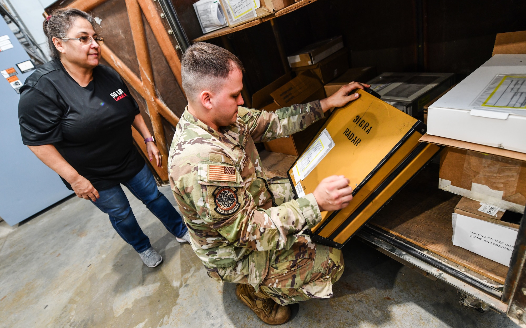 Staff Sgt. Robert Kennedy, 55th Logistics Readiness Squadron equipment accountability element craftsman, and Susan Maracle, 55th LRS equipment accountability element specialist, verify serial numbers on assets at Offutt Air Force Base, September 23. The 55th LRS completed a one hundred percent accountability of all equipment and vehicles in preparation for the Department of Defense's Financial Improvement and Audit Readiness inspection. (U.S. Air Force photo by Chad Watkins)