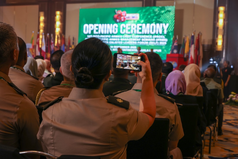 A U.S. Army Soldier records the opening ceremony of the 14th Indo-Pacific Armies Chiefs Conference (IPACC), the 49th Indo-Pacific Army Management Seminar (IPAMS), and the 11th Senior Enlisted Leaders Forum (SELF), held in Kuala Lumpur, Malaysia, September 23–25, 2025.