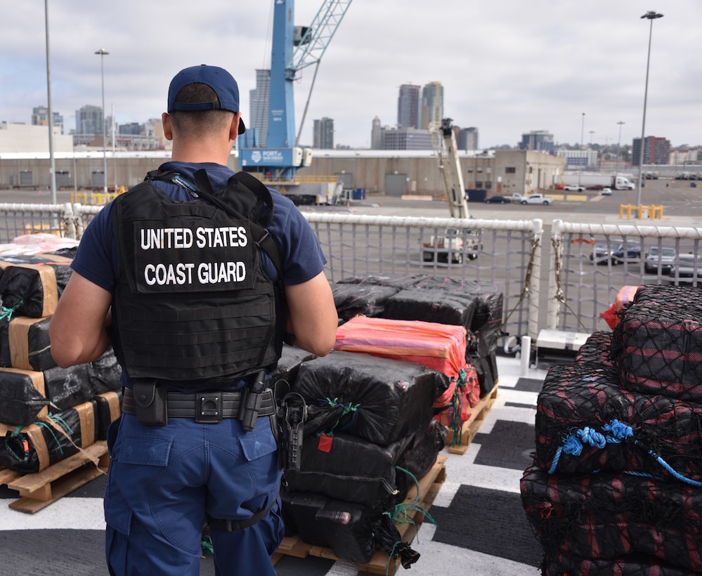 U.S. Coast Guard Cutter Midgett (WMSL 757) crewmembers offload bales of seized narcotics in San Diego, Sept. 25, 2025. The drugs, worth an estimated $156 million, were seized in international waters of the Eastern Pacific Ocean.