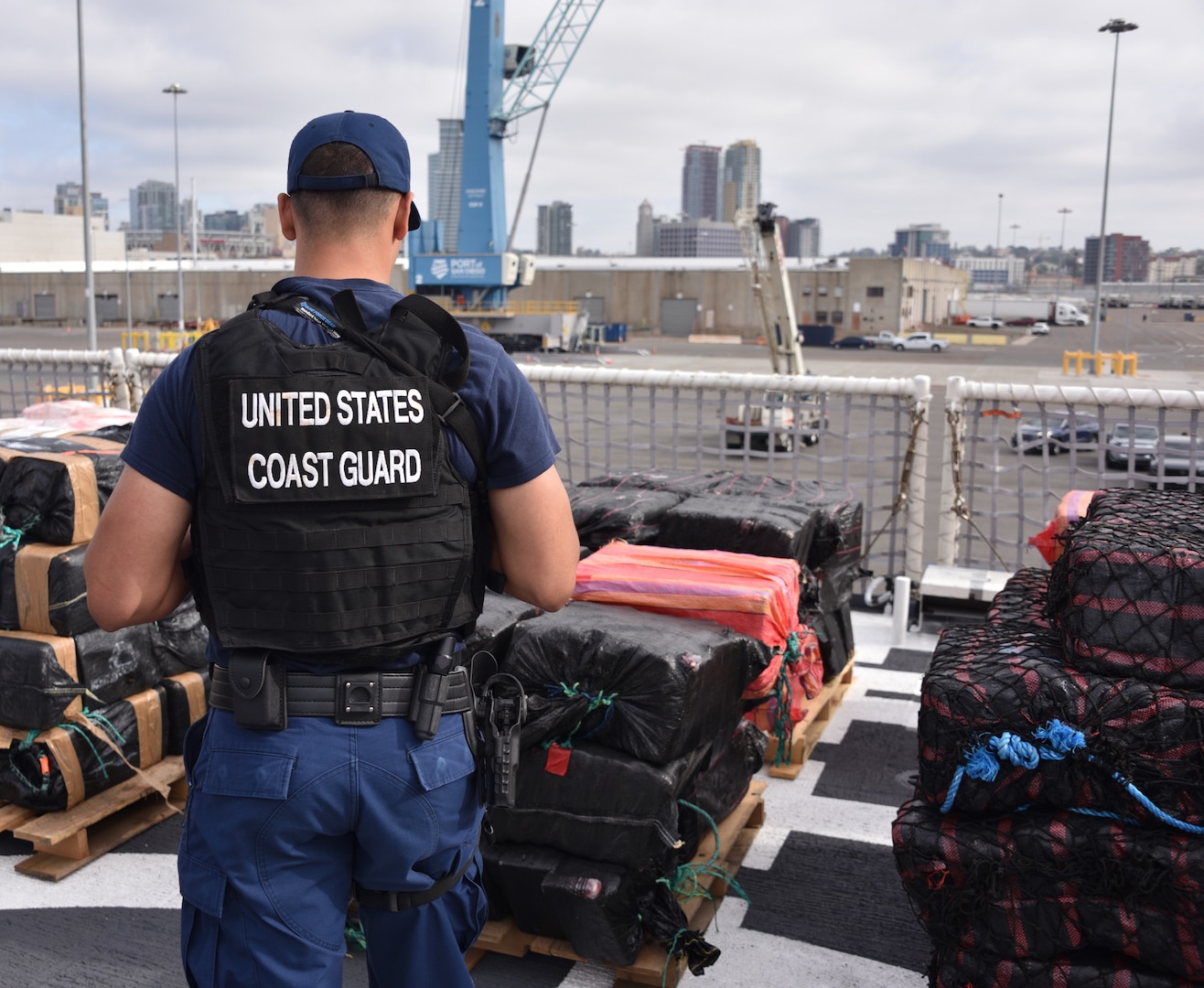 U.S. Coast Guard Cutter Midgett (WMSL 757) crewmembers offload bales of seized narcotics in San Diego, Sept. 25, 2025. The drugs, worth an estimated $156 million, were seized in international waters of the Eastern Pacific Ocean.
