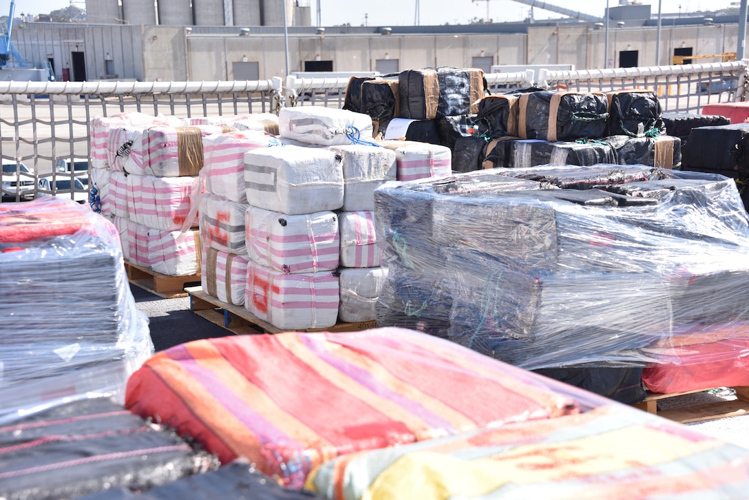 U.S. Coast Guard Cutter Midgett (WMSL 757) crewmembers offload bales of seized narcotics in San Diego, Sept. 25, 2025. The drugs, worth an estimated $156 million, were seized in international waters of the Eastern Pacific Ocean.