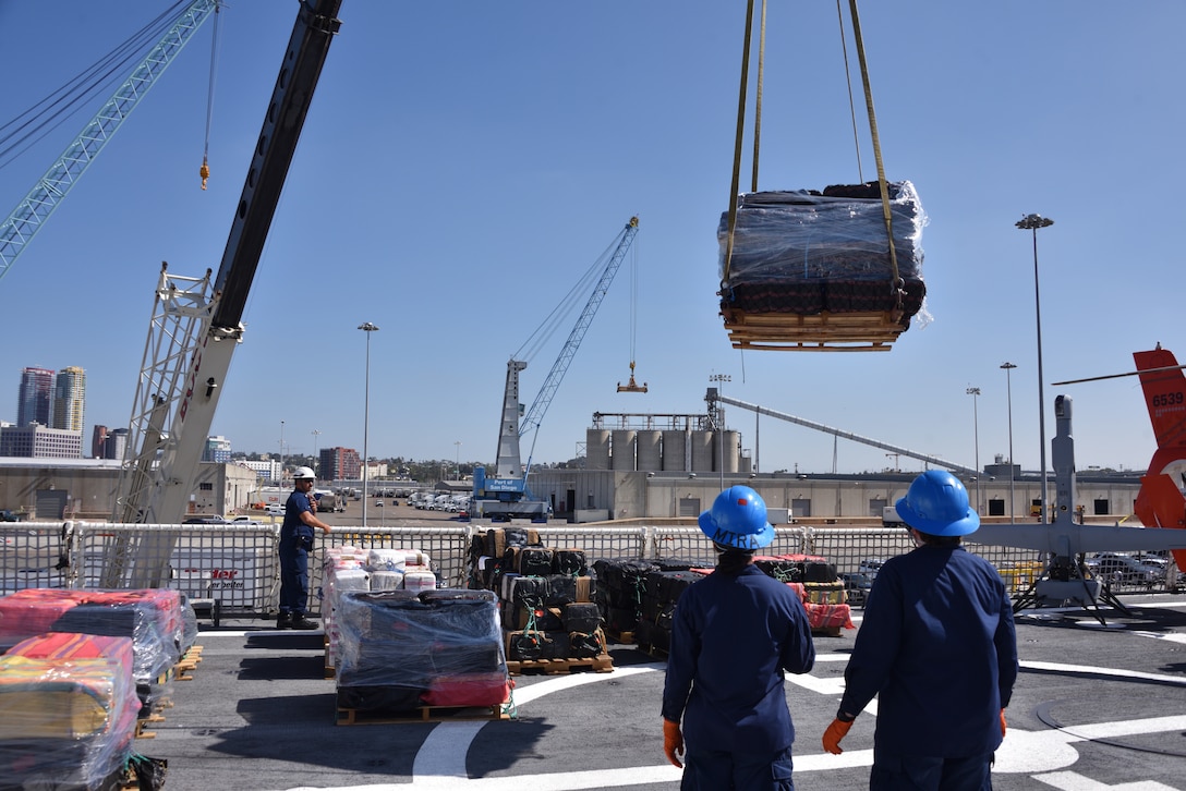 U.S. Coast Guard Cutter Midgett (WMSL 757) crewmembers offload bales of seized narcotics in San Diego, Sept. 25, 2025. The drugs, worth an estimated $156 million, were seized in international waters of the Eastern Pacific Ocean.