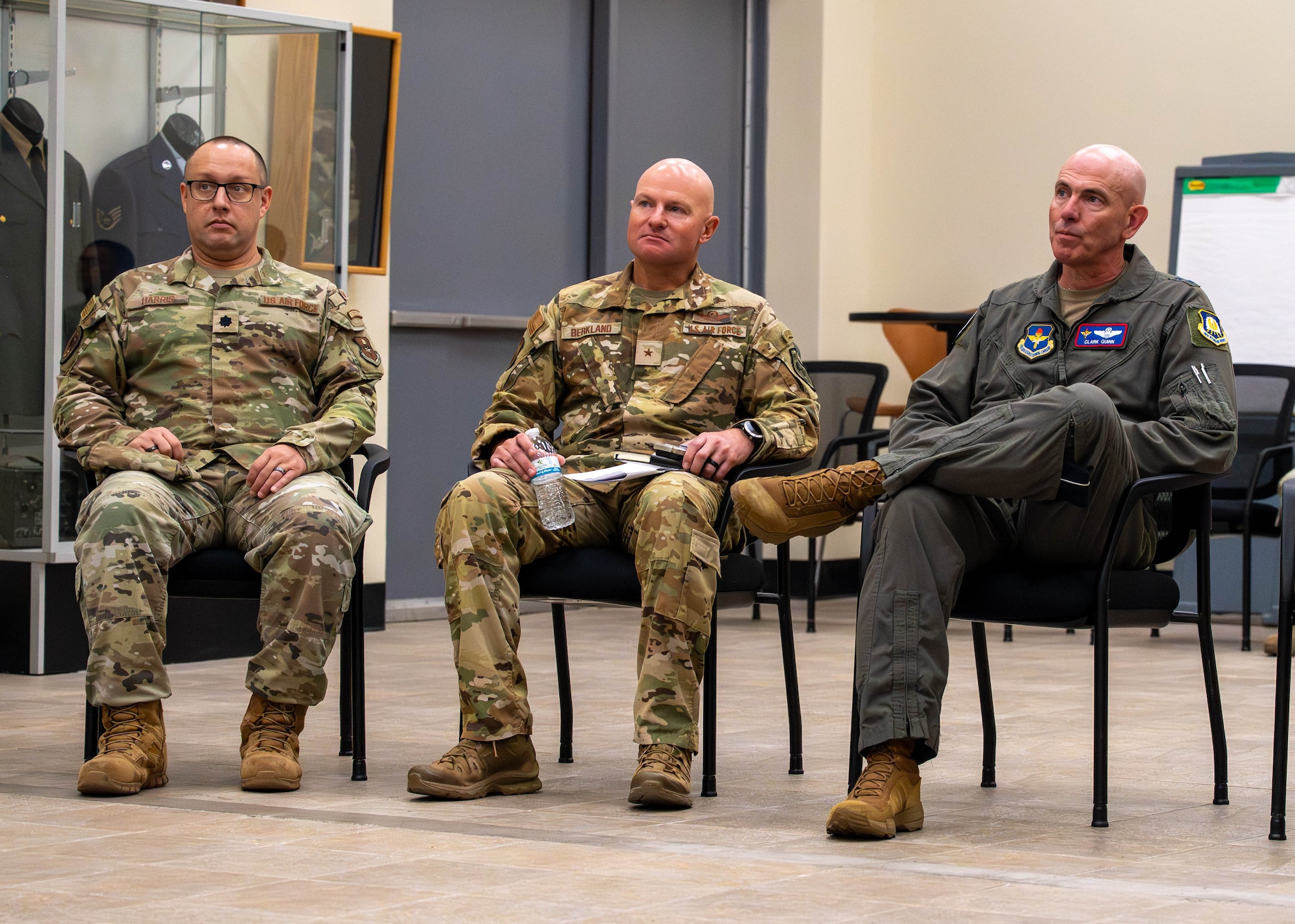U.S. Air Force Maj. Gen. Clark Quinn (right), Air Education and Training Command deputy commander, attends a briefing with Brig. Gen. David Berkland (center), 56th Fighter Wing commander, and Lt. Col. Luke Harris (left), 62nd Fighter Squadron commander, about the Luke Air Force Base Airman Leadership School, Sept. 16, 2025, at Luke AFB, Arizona.