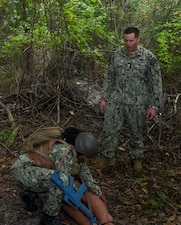250918-N-FB730-1045 CAMP LEJEUNE. (September 18, 2025) Hospital Corpsman first class Andrew Miller, who recently attained certification as a paramedic-qualified corpsmen, gives instructions during a tactical combat casualty care (TCCC) drill on September 18, 2025. TCCC is a military medical training course that focuses on training hospital corpsmen on how to provide immediate care to casualties in a combat environment. (U.S. Navy photo by Mass Communications Specialist second class Justin Woods)