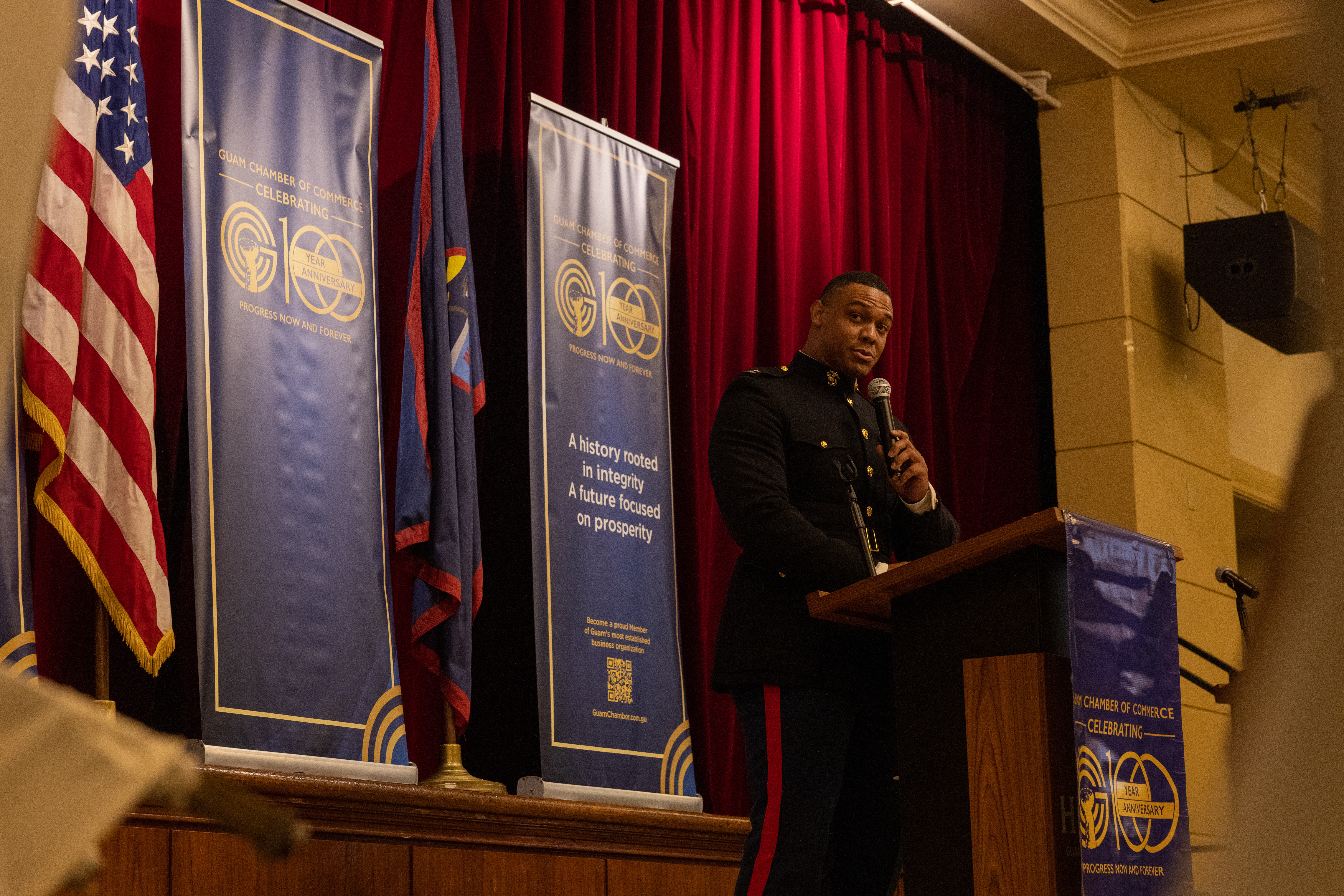 U.S. Marine Corps Capt. Ryan West, communications operations officer, Headquarters Company, Marine Corps Base Camp Blaz, delivers a speech to the Guam Chamber of Commerce during the Toys for Tots kick-off in Tumon, Guam, Sept. 23, 2025. This year marks the 16th year Toys for Tots has been part of the Guam community. (U.S. Marine Corps photo by Cpl. Ryan Little)