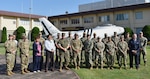 U.S. Military human resources personnel stationed in Japan and Hawaii pose for a group photo in front of the U.S. Forces Japan headquarters building during a theater human resource symposium hosted by the USFJ J1 staff on Yokota Air Base, Sept. 16, 2025. The transition of USFJ to a Joint Force Headquarters will upgrade respective command and control frameworks to enable seamless integration of operations and capabilities between U.S. and Japanese forces. (U.S. Air Force photo by Tech. Sgt. Emerson Nuñez)