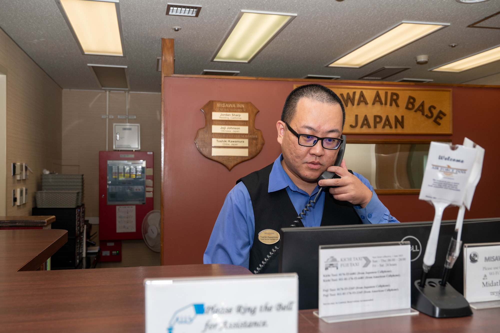 Toshiki Kawamura, guest services representative at the Misawa Inn, answers the phone on Misawa Air Base, Japan, Sep. 12, 2025.