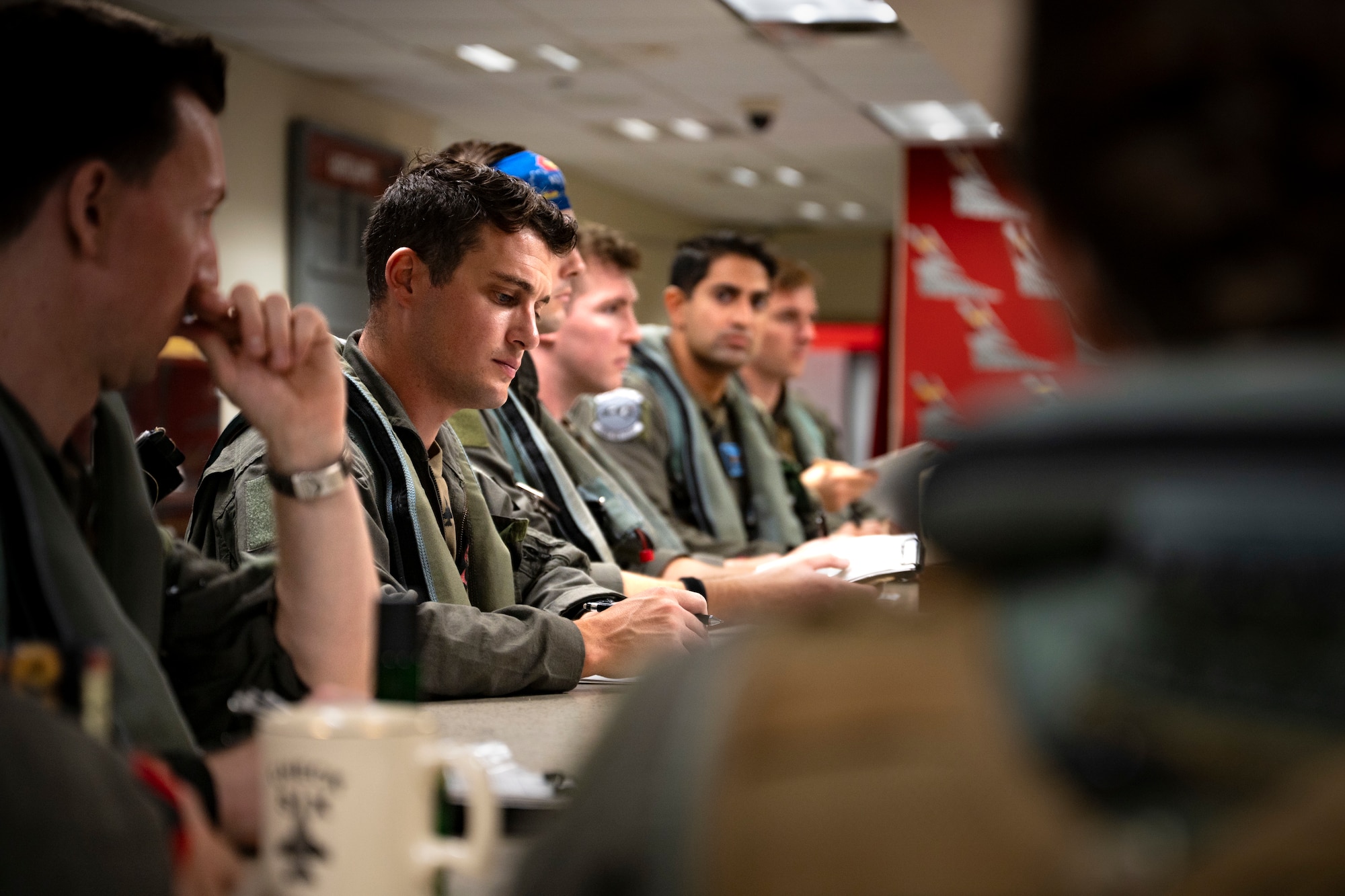 U.S. Air Force pilots assigned to the 36th Fighter Squadron receive a prebrief before take off at Osan Air Base, Republic of Korea, Sept. 18, 2025.