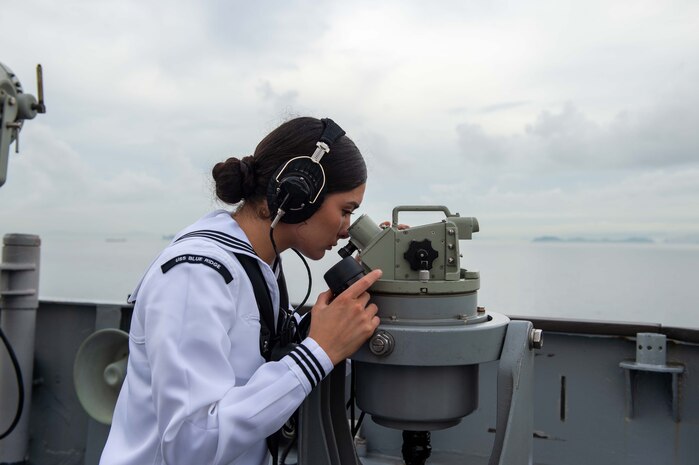 Quartermaster 3rd Class Lauren Davilla stands bridge lookout watch aboard U.S. 7th Fleet flagship USS Blue Ridge (LCC 19) while sailing into Busan, South Korea, Sept. 25, 2025.