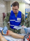 YOKOSUKA, Japan (Sept. 23, 2025) – A hospital corpsman assigned to U.S. Navy Medicine Readiness and Training Command (USNMRTC) Yokosuka attends to a simulated casualty in the delayed treatment area during a mass casualty drill. The exercise evaluated the command’s ability to triage, stabilize and transport patients during a large-scale crisis. (U.S. Navy photo by Daniel Taylor/USNMRTC Yokosuka Public Affairs)