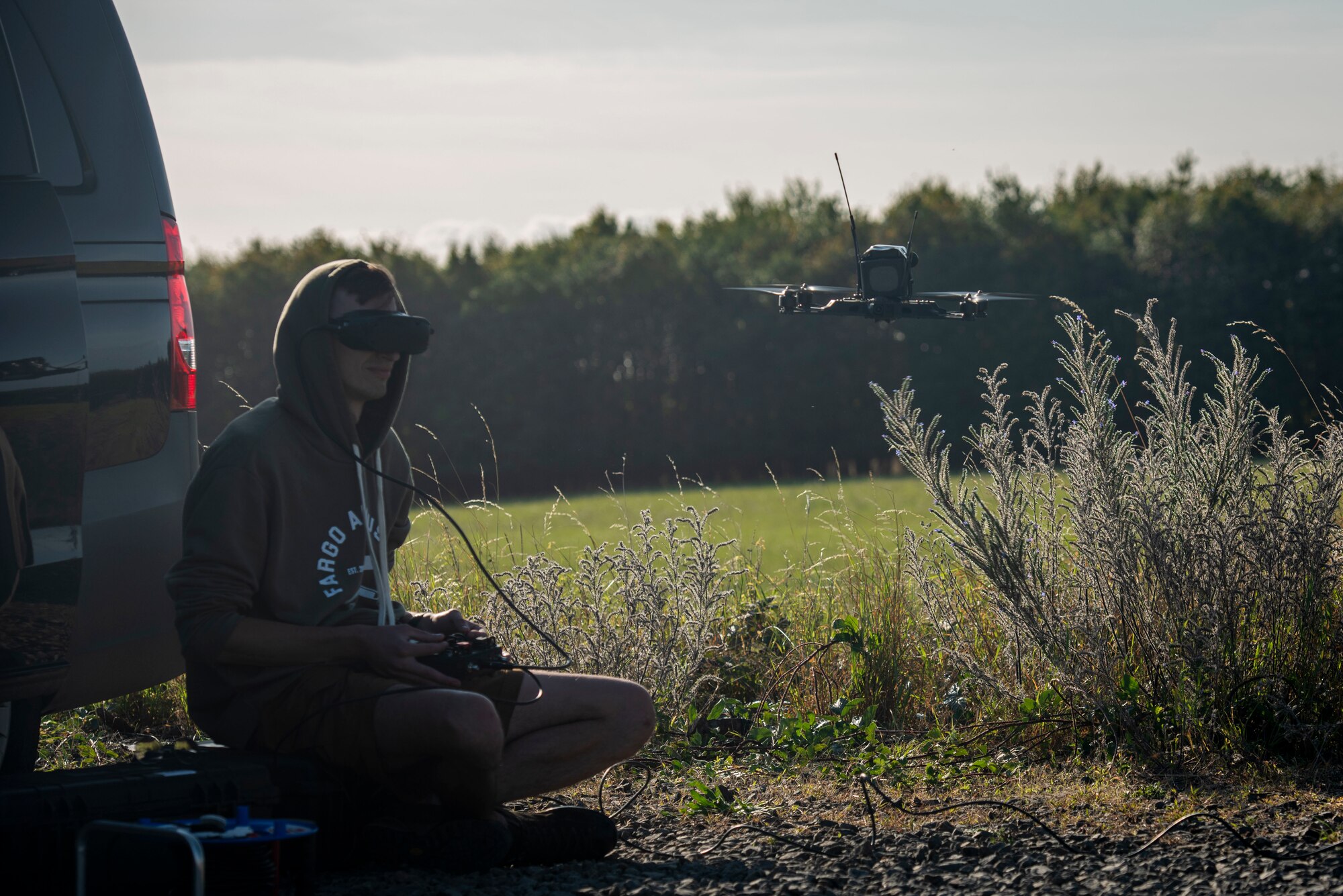 A civilian contractor operates a small drone with virtual reality goggles as a part of an operational utility assessment on Sept. 4, 2025.