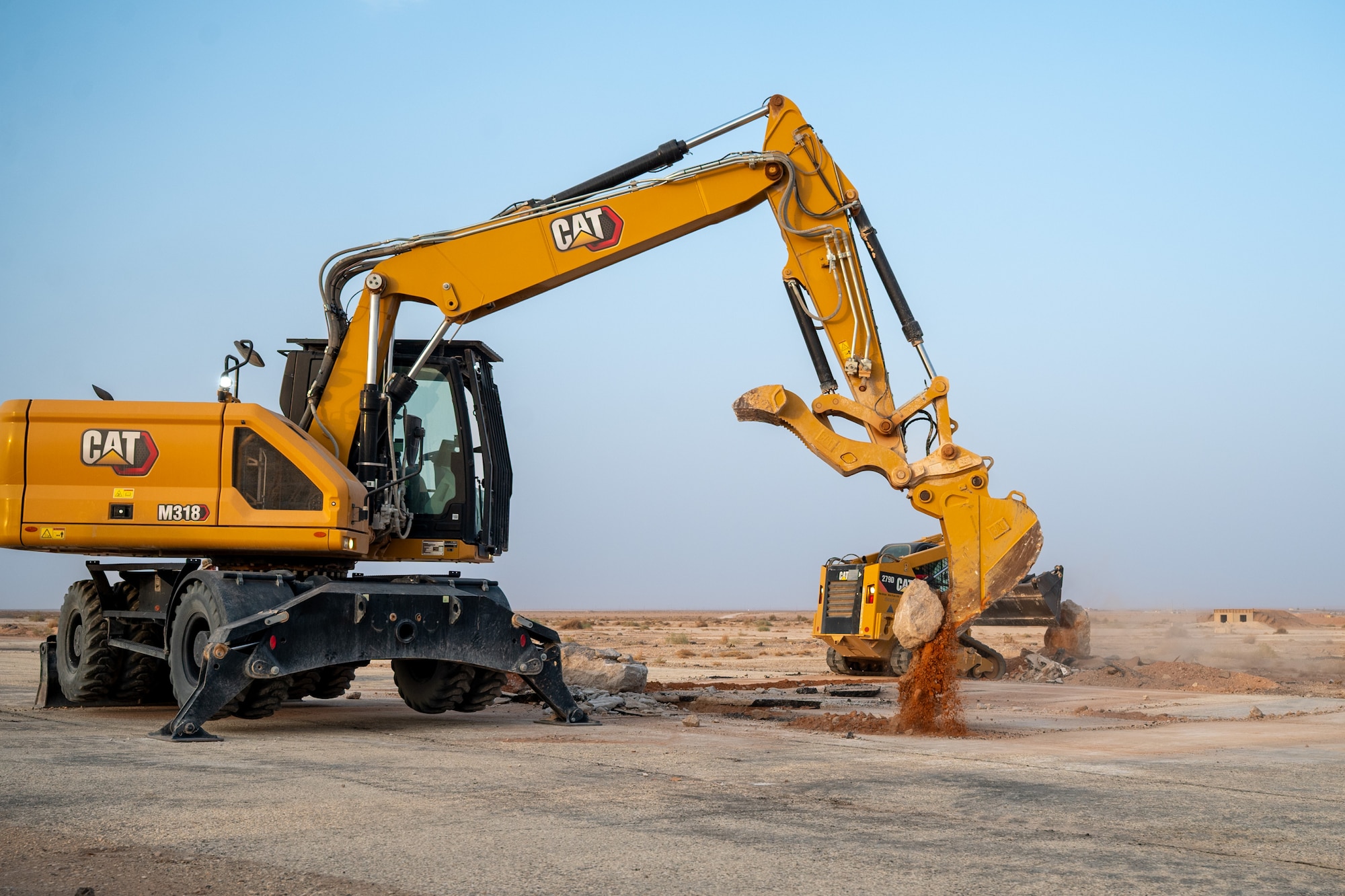 Bulldozer drops a rock