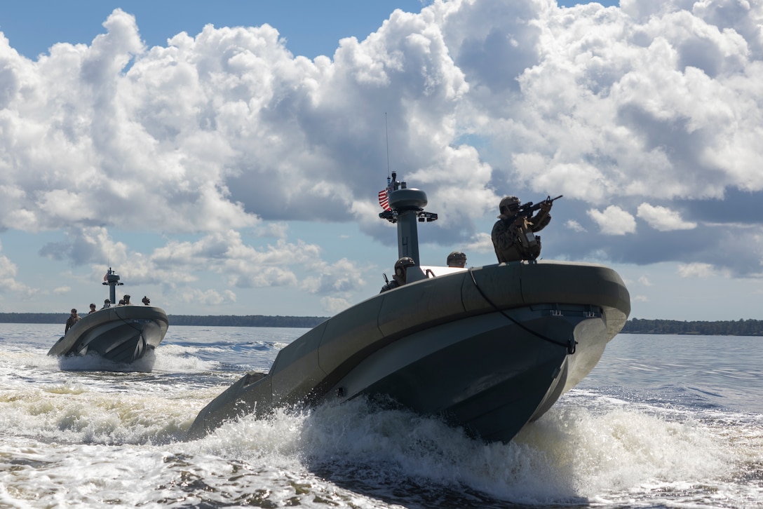 U.S. Marines with 4th Assault Amphibian Battalion, 4th Marine Division, hold security of a moving ship while on a Multi Mission Reconnaissance Craft-A littoral craft as marines with Infantería de Marina Colombiana (Colombian marine corps) conduct visit, board, search and seizure training during exercise UNITAS 2025 Marine Corps Air Station Cherry Point, North Carolina, Sept. 23, 2025. UNITAS, which is Latin for “unity,” was conceived in 1959 and has taken place annually since first conducted in 1960. This year marks the 66th iteration of the world’s longest running annual multinational maritime exercise. (U.S. Marine Corps photo by Lance Cpl. Payton Goodrich)