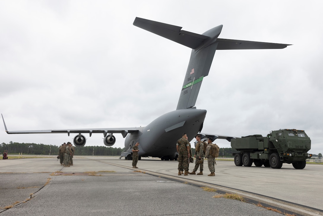 U.S. Marines with Echo Battery, 2nd Battalion, 10th Marine Regiment, 2nd Marine Division, complete an interval training exercise at the Aerial Port of Embarkation, Marine Corps Air Station Cherry Point, North Carolina, Sept. 9, 2025. Hosted by Marine Corps Combat Logistics Group 21, Aerial Port of Embarkation/Disembarkation, are responsible for movement of more than 400 flights, 38,000 passengers, and 6,800 short tons of cargo in the span of a year to fulfill the Department of Defense mission of ensuring national security. (U.S Marine Corps photo by Lance Cpl. Emma Powell)
