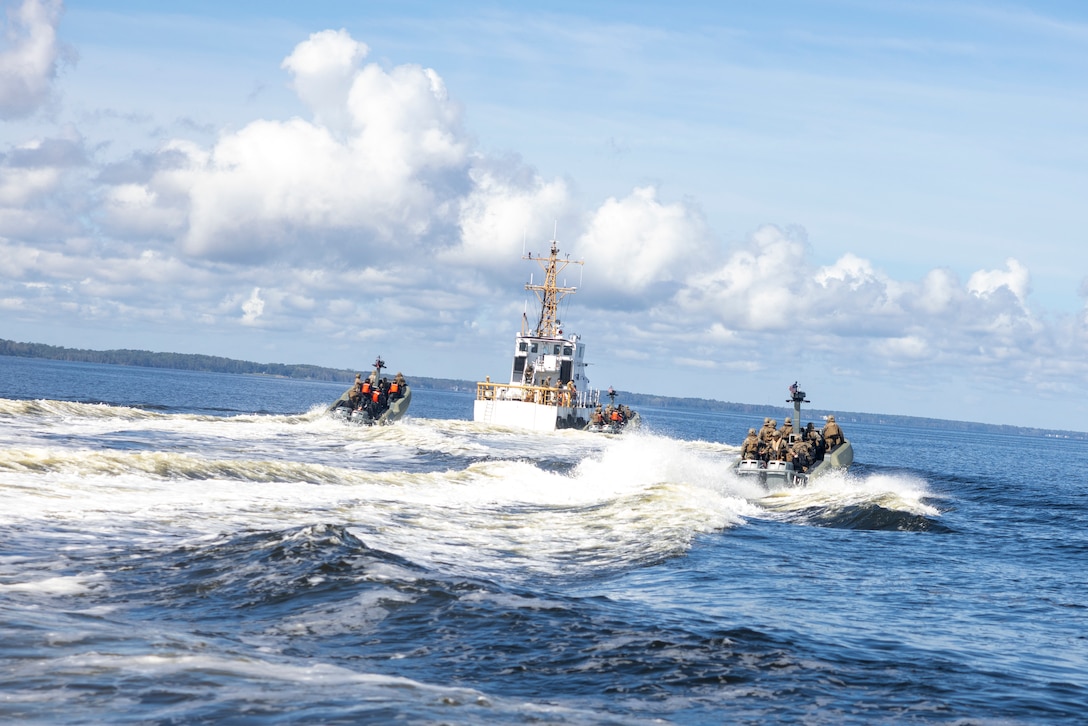 U.S. Marines with 4th Assault Amphibian Battalion, and marines with Batallón de Infantería de Marina, Armada de la República Dominicana, (marine Infantry Battalion within the Dominican navy) pull up to a moving ship while on Multi Mission Reconnaissance Craft-A littoral craft, to conduct visit, board, search and seizure training during exercise UNITAS 2025 Marine Corps Air Station Cherry Point, North Carolina, Sept. 23, 2025. UNITAS, which is Latin for “unity,” was conceived in 1959 and has taken place annually since first conducted in 1960. This year marks the 66th iteration of the world’s longest running annual multinational maritime exercise. (U.S. Marine Corps photo by Lance Cpl. Payton Goodrich)