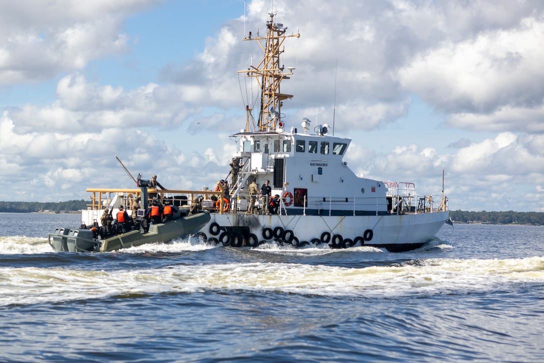 U.S. Marines with 4th Assault Amphibian Battalion, 4th Marine Division and marines with Batallón de Infantería de Marina, Armada de la República Dominicana, (marine Infantry Battalion within the Dominican navy) board a moving ship while on Multi Mission Reconnaissance Craft-A littoral craft, to conduct visit, board, search and seizure training during exercise UNITAS 2025 Marine Corps Air Station Cherry Point, North Carolina, Sept. 23, 2025. UNITAS, which is Latin for “unity,” was conceived in 1959 and has taken place annually since first conducted in 1960. This year marks the 66th iteration of the world’s longest running annual multinational maritime exercise. (U.S. Marine Corps photo by Lance Cpl. Payton Goodrich)