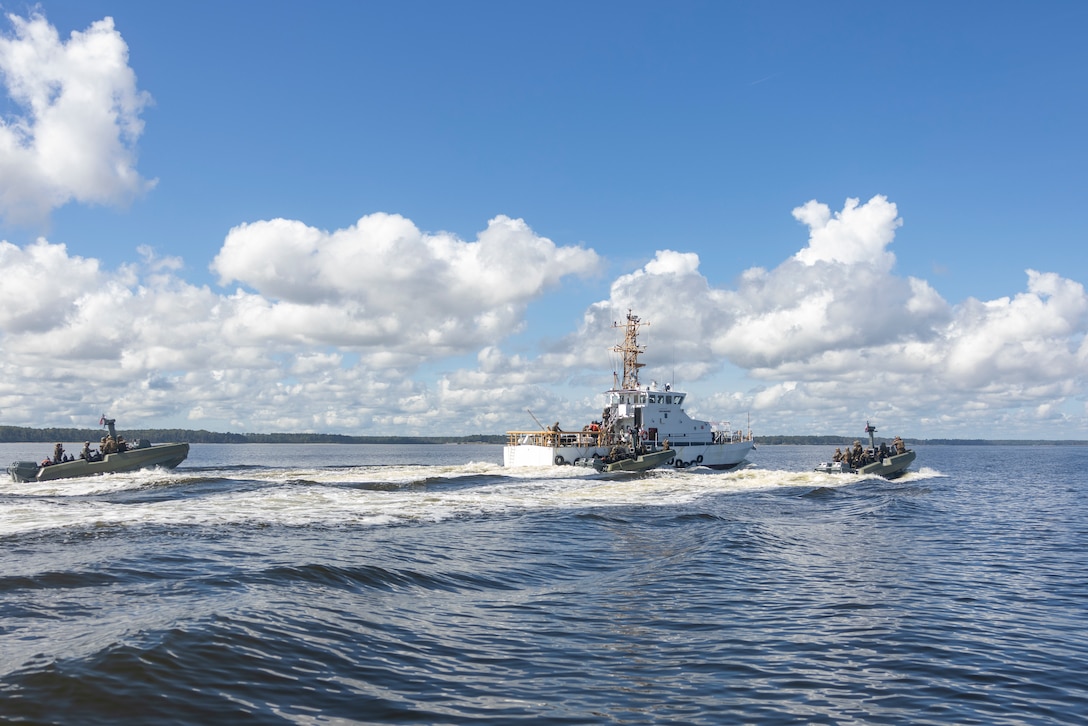 U.S. Marines with 4th Assault Amphibian Battalion, 4th Marine Division and marines with Infantería de Marina Colombiana (Colombian marine corps) pull up to a moving ship while on Multi Mission Reconnaissance Craft-A littoral crafts, to conduct visit, board, search and seizure training during exercise UNITAS 2025 Marine Corps Air Station Cherry Point, North Carolina, Sept. 23, 2025. UNITAS, which is Latin for “unity,” was conceived in 1959 and has taken place annually since first conducted in 1960. This year marks the 66th iteration of the world’s longest running annual multinational maritime exercise. (U.S. Marine Corps photo by Lance Cpl. Payton Goodrich)