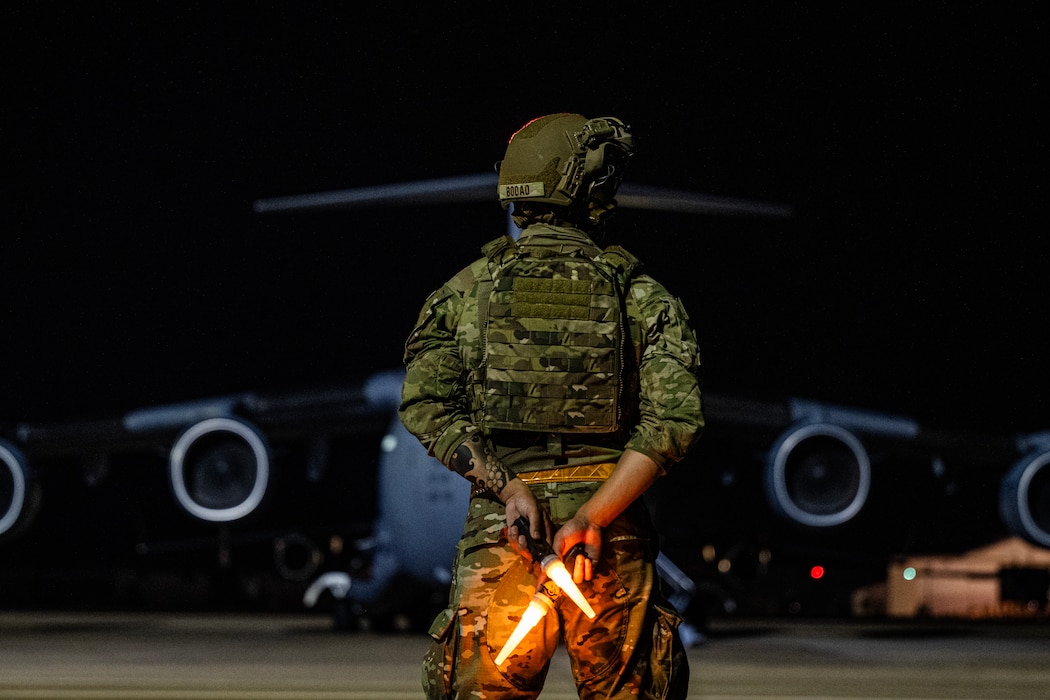 Airmen on flightline in front of C-17