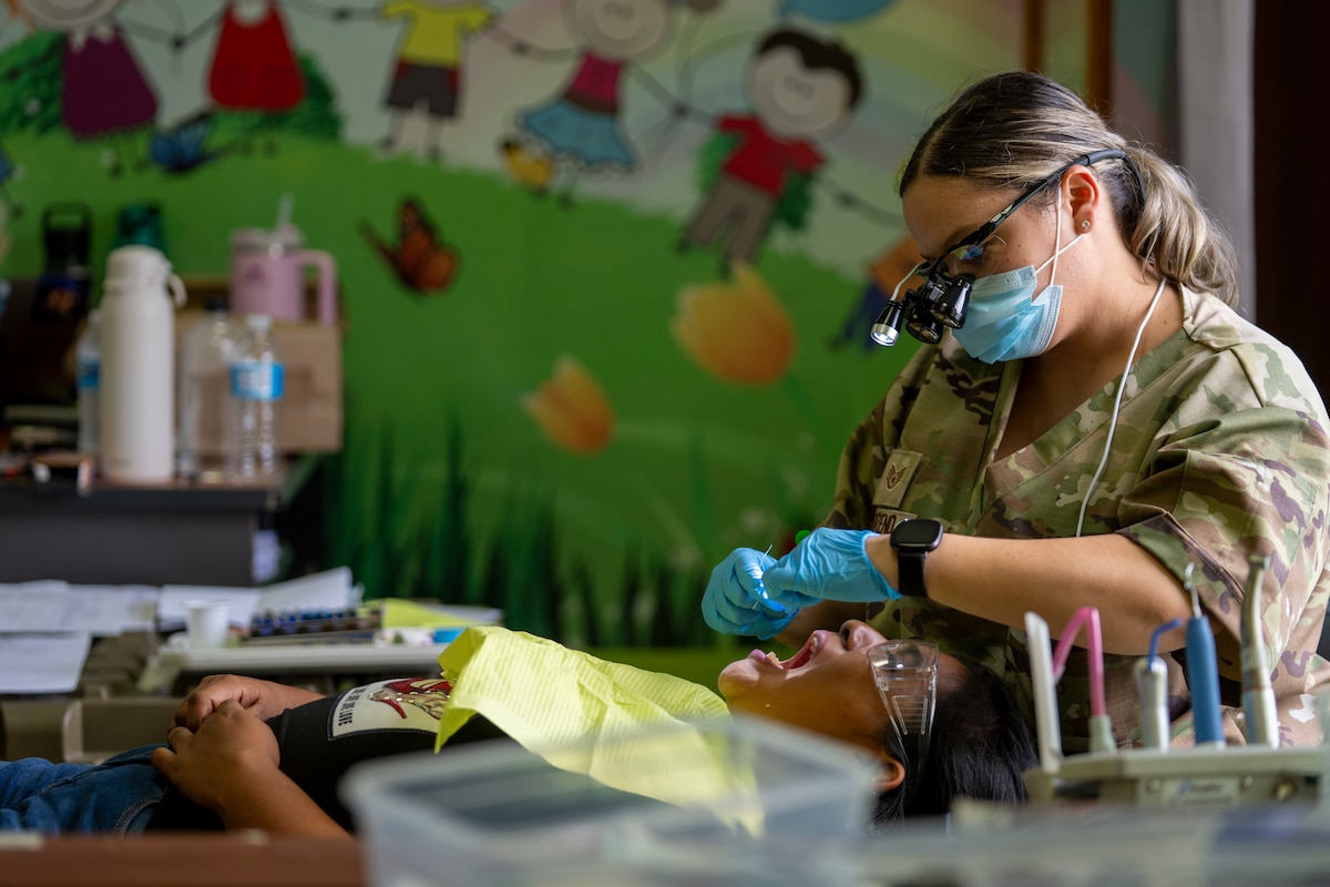 U.S. Air Force Staff Sgt. Melody Moreno, 82nd Medical Group dental technician, performs a dental cleaning at the Centro de Salud de La Mesa, Panama, Sept. 17, 2025. The dental effort was part of AMISTAD 2025, a global health engagement showcasing multinational teamwork focused on improving access to care and building long-term capacity. (U.S. Air Force photo by Andrea Jenkins)