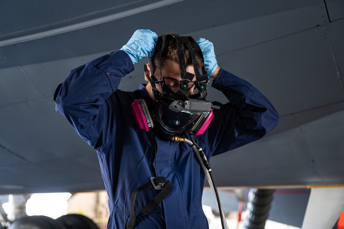 U.S. Air Force Airman 1st Class William Brice, 100th Maintenance Squadron, dons an Integrated Respirator Information System at RAF Mildenhall, England, Sept. 2, 2025.