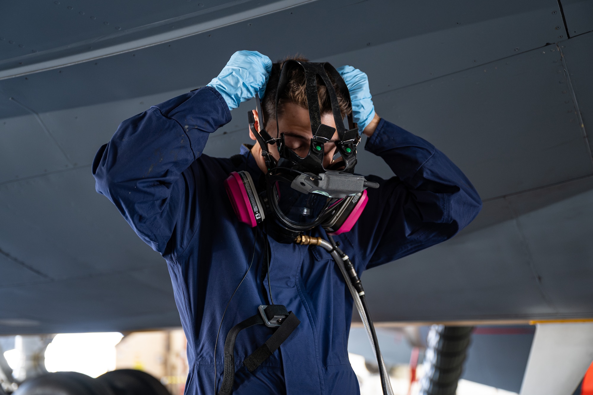 U.S. Air Force Airman 1st Class William Brice, 100th Maintenance Squadron, dons an Integrated Respirator Information System at RAF Mildenhall, England, Sept. 2, 2025.