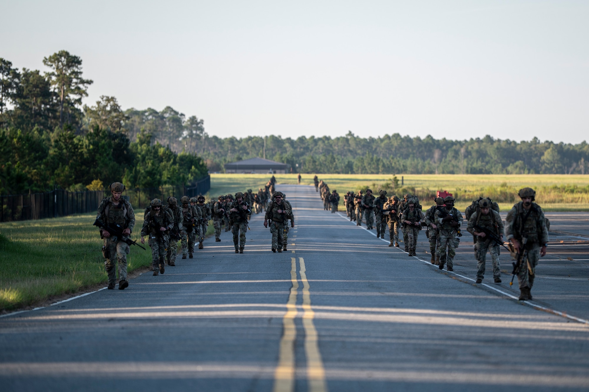 U.S. Air Force Airmen assigned to the 823rd Base Defense Squadron perform a formation ruck at Moody Air Force Base, Georgia, Sept. 15, 2025. Airmen carried heavy ruck loads across varied terrains to build endurance and to prepare to operate in austere environments. (U.S. Air Force photo by Senior Airman Leonid Soubbotine)