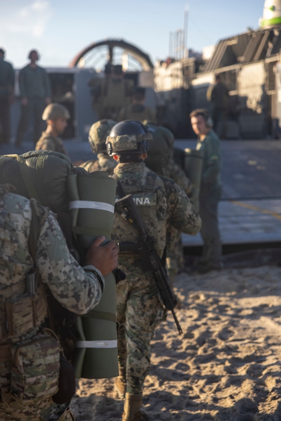 Marines with the Cuerpo de Infantería de Marina (Mexican marine corps) board a U.S. Navy landing craft, air cushion assigned to Assault Craft Unit 4 at Onslow Beach during exercise UNITAS 2025 at Marine Corps Base Camp Lejeune, North Carolina, Sept. 25, 2025. UNITAS, Latin for “unity,” was conceived in 1959 and has taken place annually since 1960. This year marks the 66th iteration of the world’s longest-running multinational maritime exercise. (U.S. Marine Corps photo by Lance Cpl. Payton Goodrich)