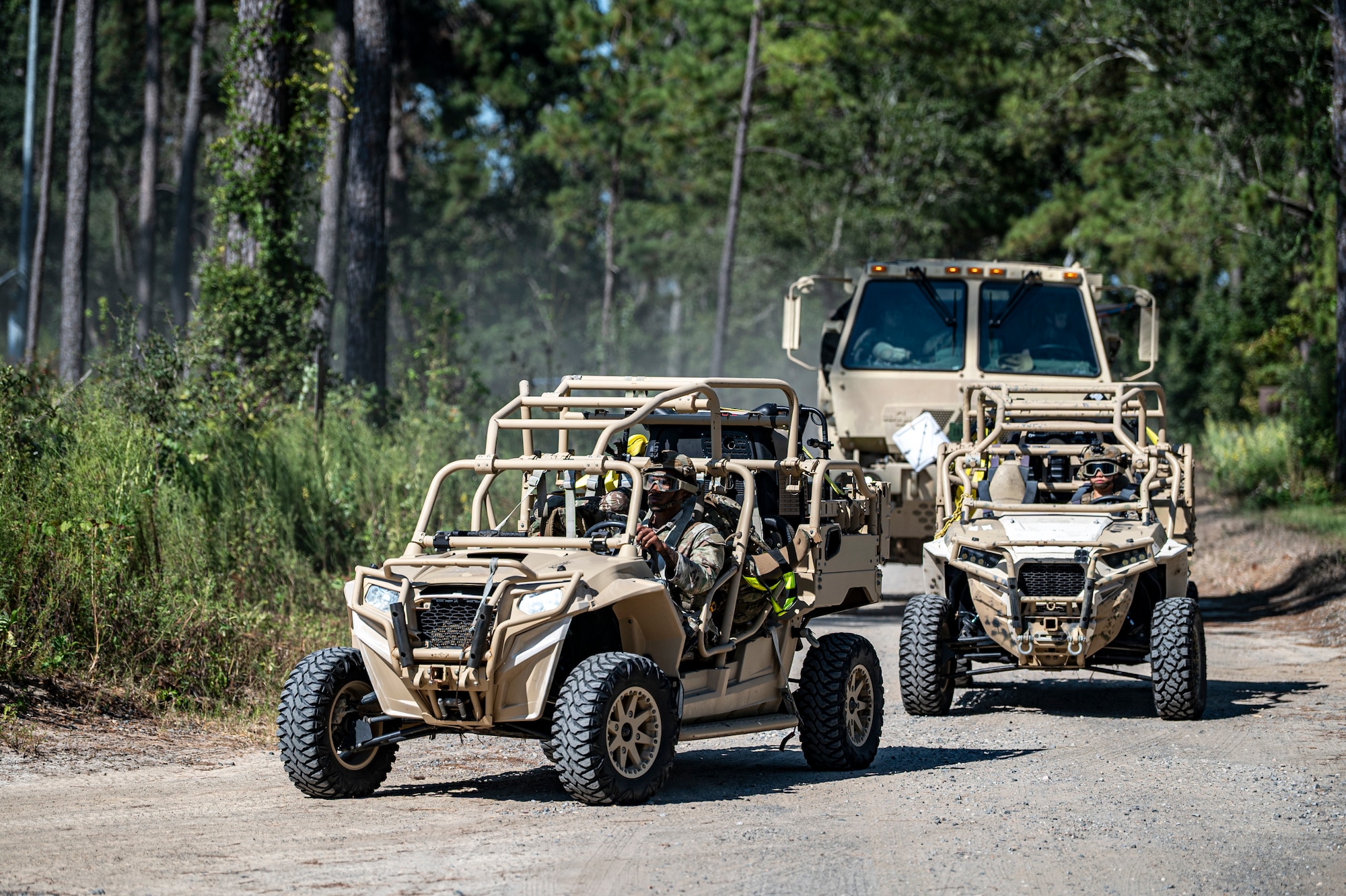 U.S. Air Force Airmen assigned to the 823rd Base Defense Squadron drive tactical vehicles at Moody Air Force Base, Georgia, Sept. 15, 2025. Exercise Prepared Jester emphasized mobility as a key element of establishing and defending a contingency location, while also reinforcing the importance of sustaining operations over multiple days in challenging conditions. (U.S. Air Force photo by Senior Airman Leonid Soubbotine)