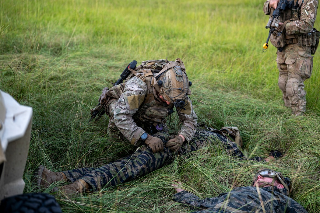 A U.S. Air Force Airman assigned to the 823rd Base Defense Squadron conducts a personnel search on a role player during Exercise Prepared Jester at Moody Air Force Base, Georgia, Sept. 18, 2025. The training reinforced core skills in security operations, ensuring defenders can respond effectively in contested environments. (U.S. Air Force photo by Senior Airman Leonid Soubbotine)