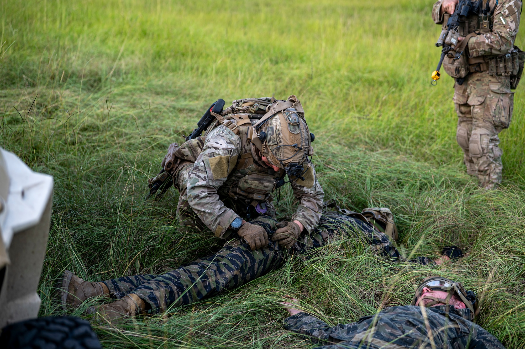 A U.S. Air Force Airman assigned to the 823rd Base Defense Squadron conducts a personnel search on a role player during Exercise Prepared Jester at Moody Air Force Base, Georgia, Sept. 18, 2025. The training reinforced core skills in security operations, ensuring defenders can respond effectively in contested environments. (U.S. Air Force photo by Senior Airman Leonid Soubbotine)