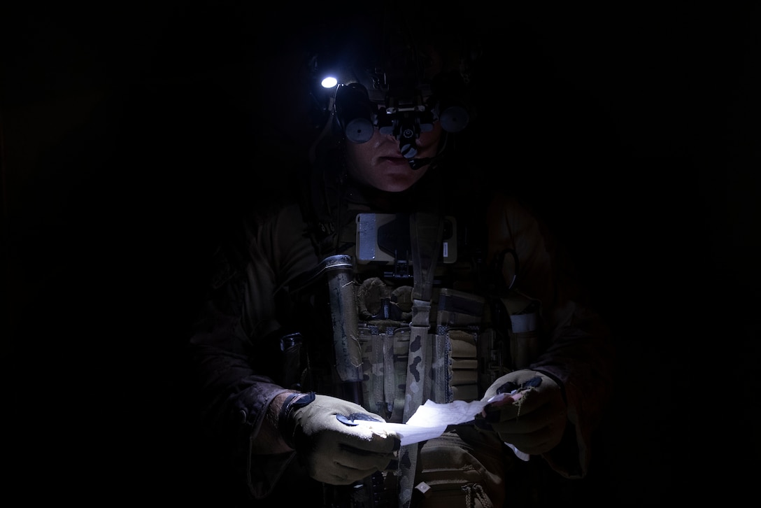 A U.S. Marine with 3rd Force Reconnaissance Company, 4th Marine Division, reads a document found in a house while participating in a nighttime raid with partner forces during exercise UNITAS 2025 Marine Corps Base Camp Lejeune, North Carolina, Sept. 23, 2025. UNITAS, which is Latin for “unity,” was conceived in 1959 and has taken place annually since first conducted in 1960. This year marks the 66th iteration of the world’s longest running annual multinational maritime exercise. (U.S. Marine Corps photo by Lance Cpl. Payton Goodrich)