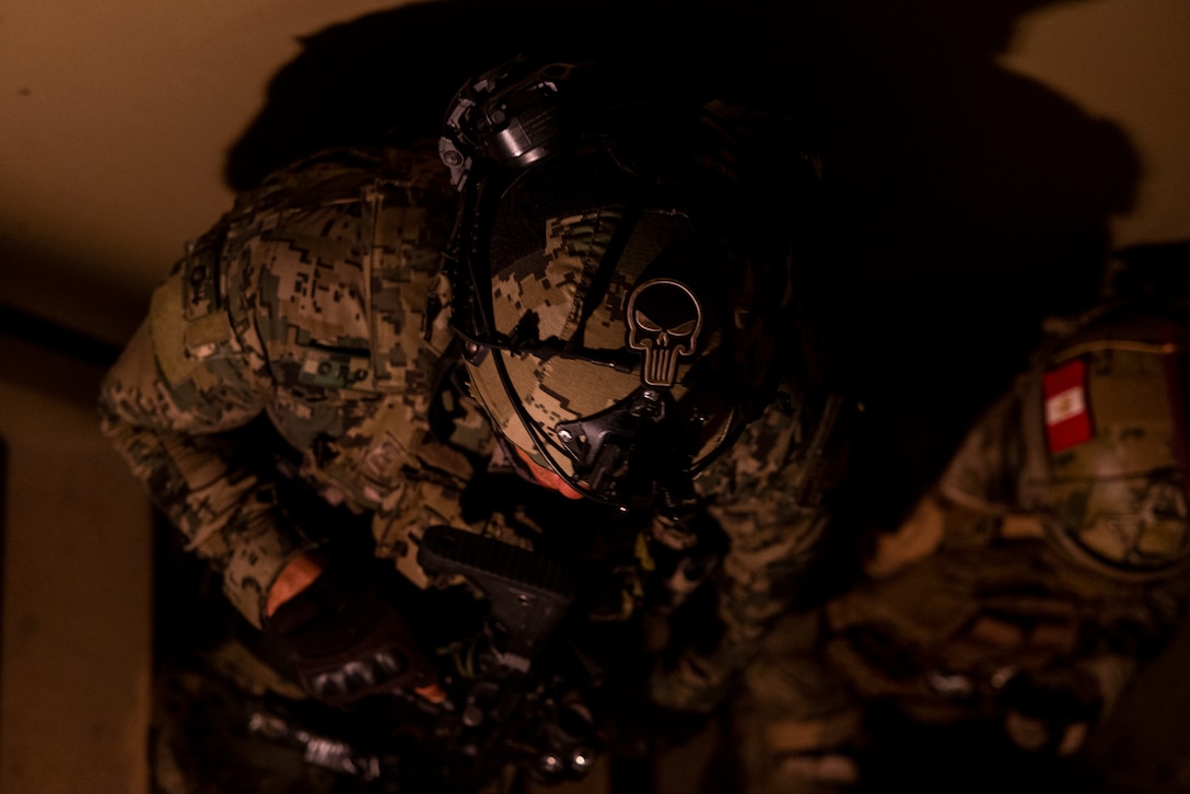 A marine with Cuerpo de Infantería de Marina (Mexican marine corps), stacks up in a stairwell to breach a room during a nighttime raid with partner forces during exercise UNITAS 2025 Marine Corps Base Camp Lejeune, North Carolina, Sept. 23, 2025. UNITAS, which is Latin for “unity,” was conceived in 1959 and has taken place annually since first conducted in 1960. This year marks the 66th iteration of the world’s longest running annual multinational maritime exercise. (U.S. Marine Corps photo by Lance Cpl. Payton Goodrich)